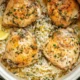 Slow Cooker Lemon Herb Chicken served with fresh herbs and lemon slices